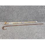 Silver collar and tip walking cane together with a hiking stick with white metal and bronze souvenir