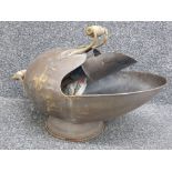 Antique brass helmet coal scuttle with shovel