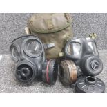 Pair of tactical gas masks and military style bag