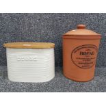 A terracotta bread crock by Henry Watson Pottery, and another.