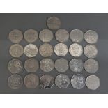 A total of 25 UK 50p coins including Peter rabbit, paddington bear, sherlock Holmes etc