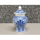 A 20th century Chinese blue and white miniature ginger jar and cover, floral decoration, with four