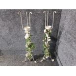 A pair of white painted metal torchieres with light up bridal flowers to supports 100cm high.