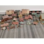 Box of miscellaneous model railroad buildings together with tub of train photographs
