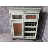 A mid 20th century green painted kitchen unit trolley 73 x 83 x 36cm.