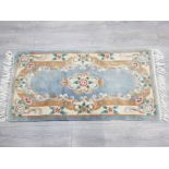 Fringed rectangular shaped chinese rug, 136x72cm