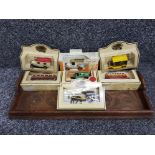 Carved exotic hardwood serving tray together with 7 boxed die cast vehicles including promotional