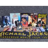A quantity of Michael Jackson tour books and an official Mj dangerous world tour fan scarf