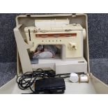 Vintage singer sewing machine in original carrycase with accessories