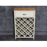 A modern cream painted wine rack with single drawer above 52 x 80 x 23.