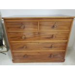A Victorian mahogany chest of five drawers with turned wooden handles 120 x 97 x 60cm.