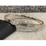 Ladies silver stone set bangle, comprising of a Marque shaped CZ