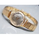 Ladies Duward King wristwatch, with 18k gold watch face case, (unreadable markings on clasp, 27.