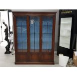 A Bevan Funnell Reprodux mahogany and glazed wall unit