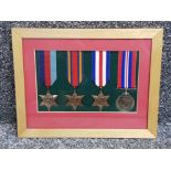 Framed and glazed World War II medals includes 1939-45 star, Burman star, France Germany star &