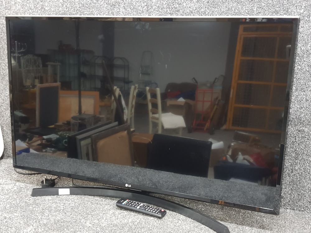 LG 43" TV on stand with lead and remote