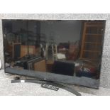 LG 43" TV on stand with lead and remote