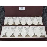 A set of twelve metal place holders by Arts de la Table.