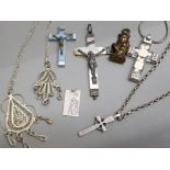 Selection of religious themed jewellery including mother of pearl crucifix, silver pendant plus