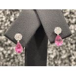 Ladies 9ct white gold pink topaz and diamond drop earrings. Set with pear shaped pink topaz and a