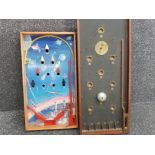 Vintage space rocket themed pinball board together with wooden Bagatelle board