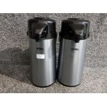 Two Thermos hot water flasks.