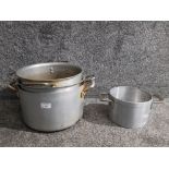 A set of three graduated aluminium heavy duty stock pans, and another.