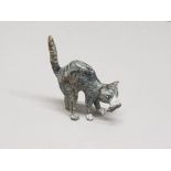 A cold painted bronze figure of a cat holding prey in mouth