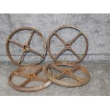 A set of four cast iron wagon wheels 60cm diameter.