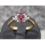 Ladies 18ct gold Ruby and diamond cluster ring. 3.1g size N1/2