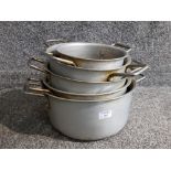 A set of 5 aluminium graduated heavy duty pans with stainless steel handles.