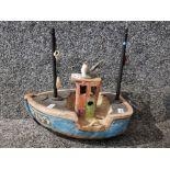 A studio pottery fishing boat with seagull 26cm long.