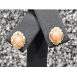 Ladies 9ct gold stone set stud earrings. Comprising of oval coral set stones