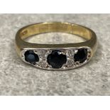 Ladies 9ct gold Sapphire and CZ ring. Featuring 3 round cut black sapphires and 2 CZs. 3.2g size