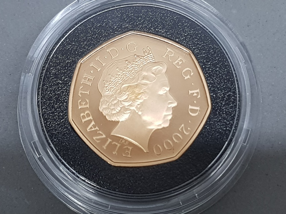 UK gold 2000 public library milestones 22ct 50p gold coin, 15.50 grams, in original case with - Image 3 of 3