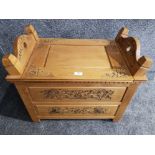 A carved wooden hall seat with lift up seat and drawer below 65cm wide.