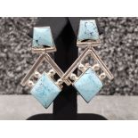 Ladies silver blue stone ornate drop earrings