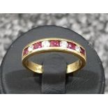 Ladies 18ct gold Ruby and diamond 9 stone band. 3.1g size M