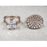 2 x ladies silver CZ rings including square stone and oval cluster. Size O and 29.3g