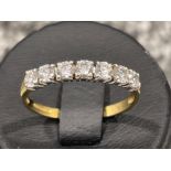 Ladies 9ct gold CZ set band. Comprising of 7 stones. 1.5G size N