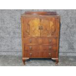 A small walnut linen cupboard with three drawers 77 x 112 x 46cm.