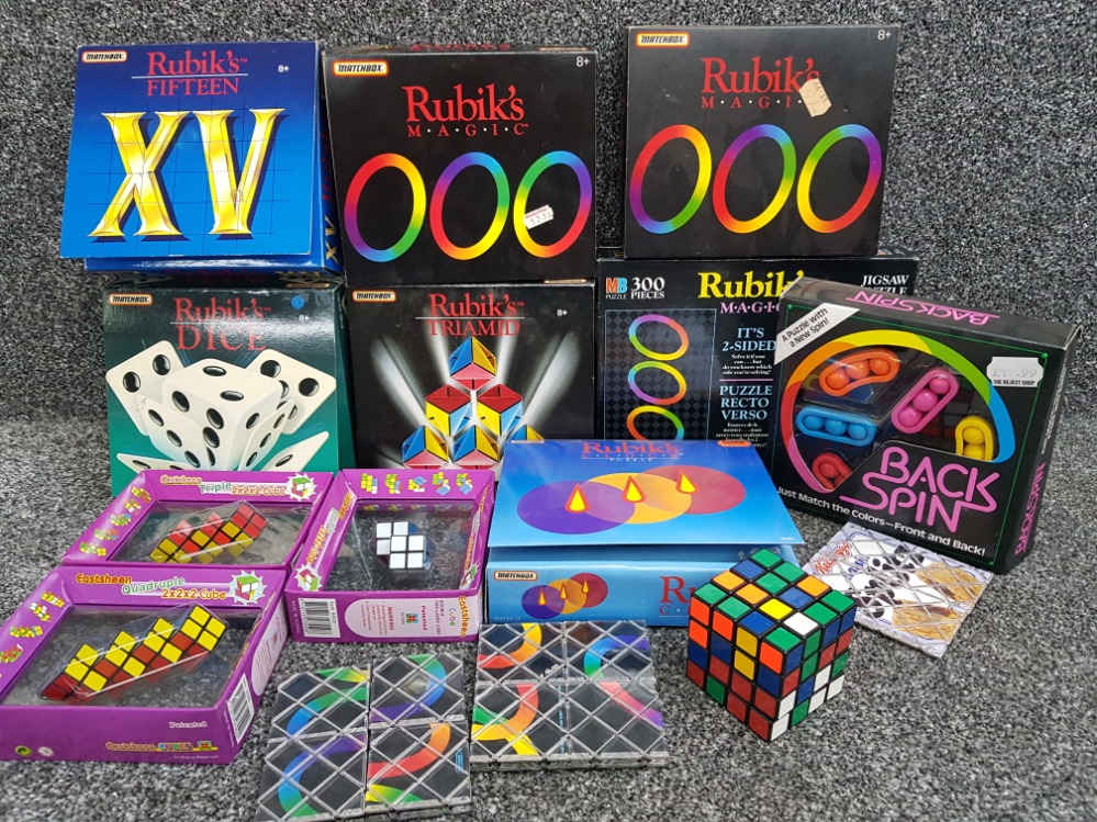 Box of Rubiks puzzles including M.a.g.i.c, Dice, clock puzzle etc most boxed