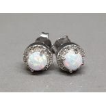 A pair of silver and cz and opal studs 2.63g gross