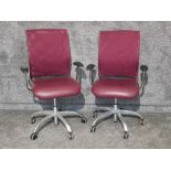 Two swivel office chairs in burgundy mesh and lestherette by Verco.