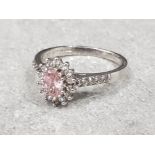 Ladies 9ct white gold pink + white stone cluster ring, comprising of a oval pink stone set in the