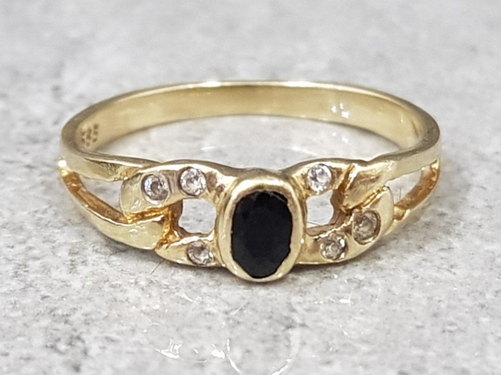 14ct yellow gold sapphire and white stone ring, comprising of a oval sapphire set in the centre with