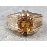 Gents 9ct yellow gold stone set ring, comprising of a citreen stone set in a claw setting, 7.8g