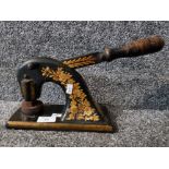 A Victorian cast iron letter press with wooden handle and floral decoration (needs attention).