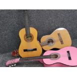 3 acoustic guitars, 2 traditional & 1 in pink