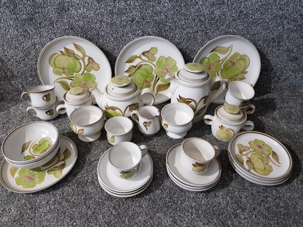 A Denby stoneware part dinner and tea service to include dinner plates, tea cups etc.